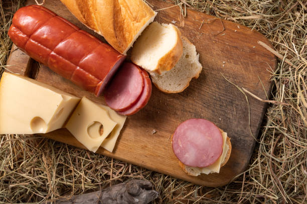 istock Breakfast in the barn. Sliced bread and sausage. 1299751032