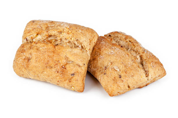 istock Fresh wholemeal roll isolated on a white background. View from another angle in the portfolio. 1299752402