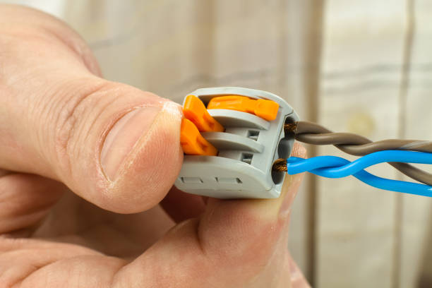 istock connecting the twisted ends of the wires using compact splicing connector 1299754620