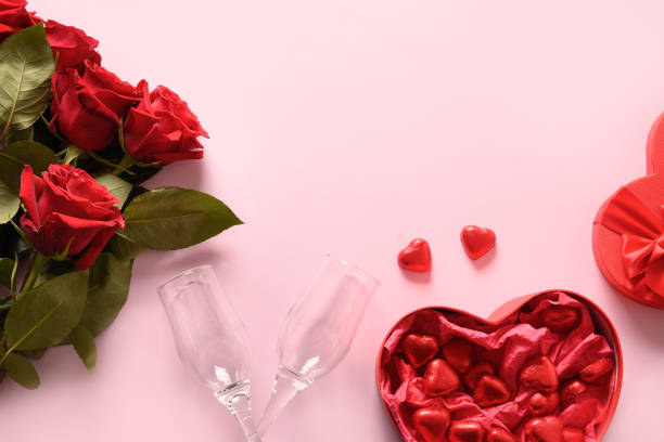 istock Red hearts chocolate sweets, wineglasses and red roses for Valentine's day. 1299755345