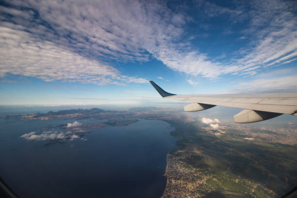 istock Travel view window plane  with mountains and clouds at background. Space for text.  Concept Image 1299755501