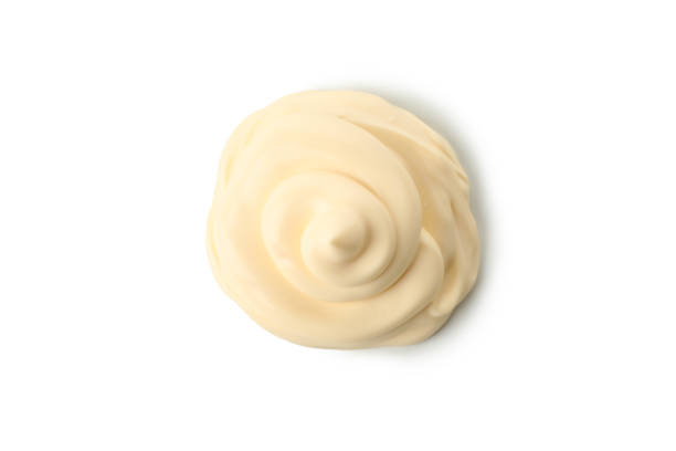 istock Mayonnaise sauce swirl isolated on white background 1299755672
