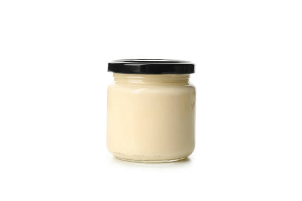 istock Jar with mayonnaise sauce isolated on white background 1299755791
