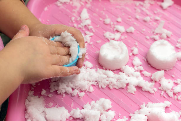 istock Child plays with artificial snow for home decoration 1299756006