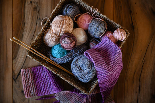 Accessories for knitting in basket ( yarn, needles) and scarf Accessories for knitting in basket ( yarn, needles) and scarf knitting needle photos stock pictures, royalty-free photos & images
