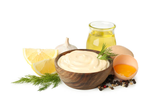 istock Bowl of mayonnaise and ingredients for cooking isolated on white background 1299756021