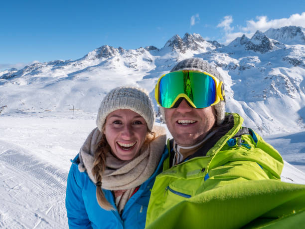 istock Couple taking selfie from ski slopes 1299756098