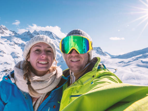 istock Couple taking selfie from ski slopes 1299756191