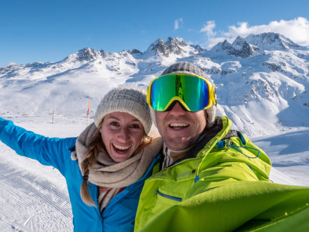 istock Couple taking selfie from ski slopes 1299756194