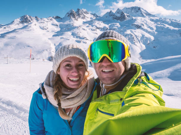 istock Couple taking selfie from ski slopes 1299756231
