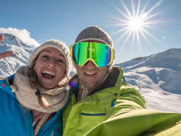 istock Couple taking selfie from ski slopes 1299756823