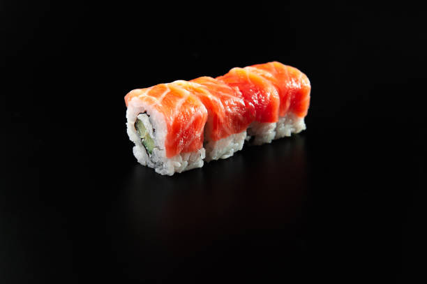 istock traditional fresh japanese sushi rolls on a black background 1299757097