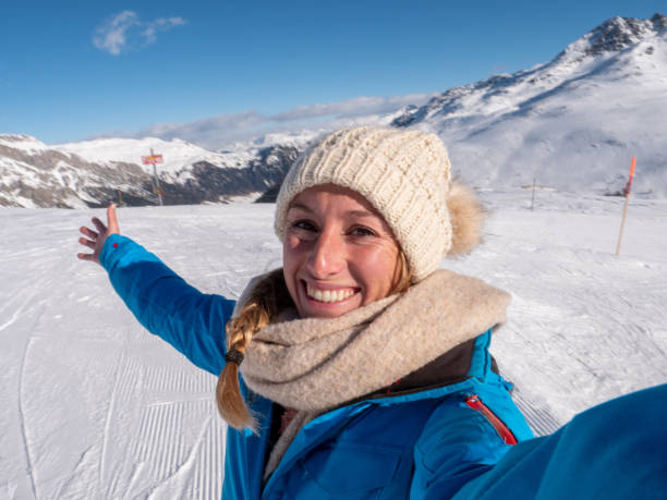 istock Woman taking selfie from ski slopes 1299757180