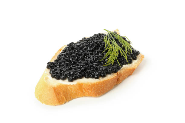 istock Sandwich with black caviar and dill isolated on white background 1299757269