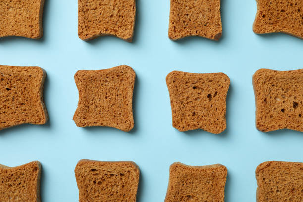 istock Flat lay with sandwich bread slices on blue background 1299757596