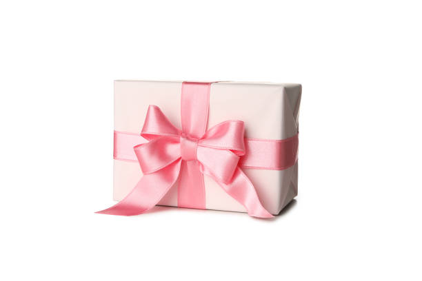 istock Gift box with pink bow isolated on white background 1299758784