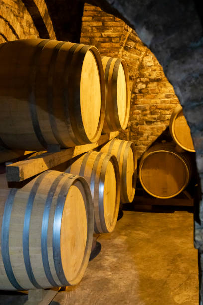 istock wine barrels in the cellar, Szekszard, Hungary 1299759665