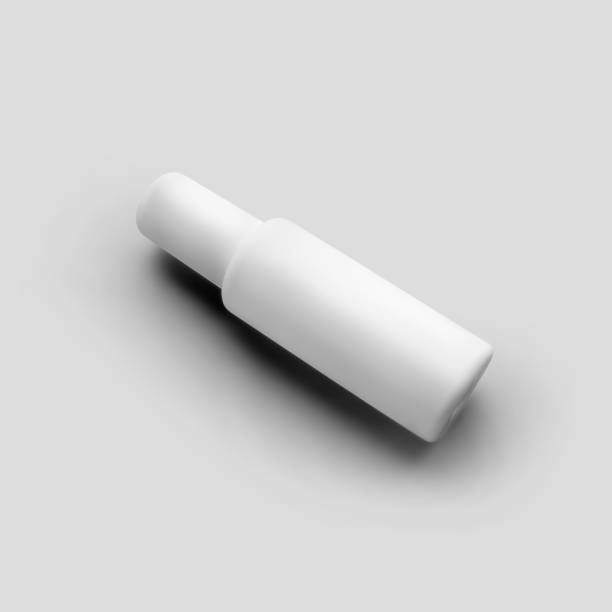 istock Mockup of matt white bottle with atomizer, cylindrical plastic vial with cap, isolated on background. 1299760471