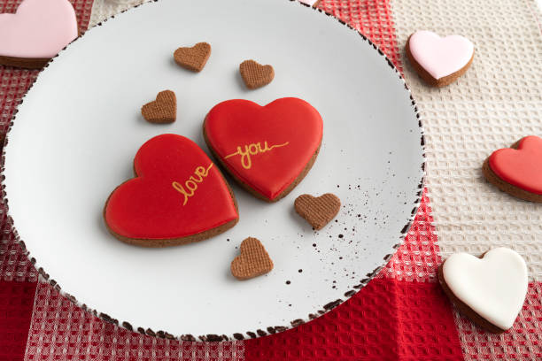 istock Red heart-shaped cookies with icing over. Valentines Day. Love, tenderness. 1299761227