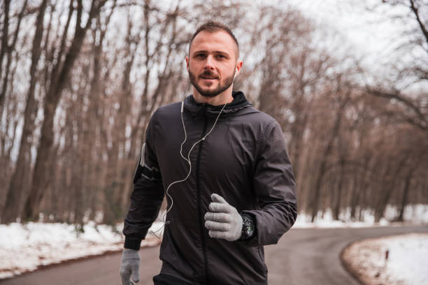 istock Man running on the road 1299766555