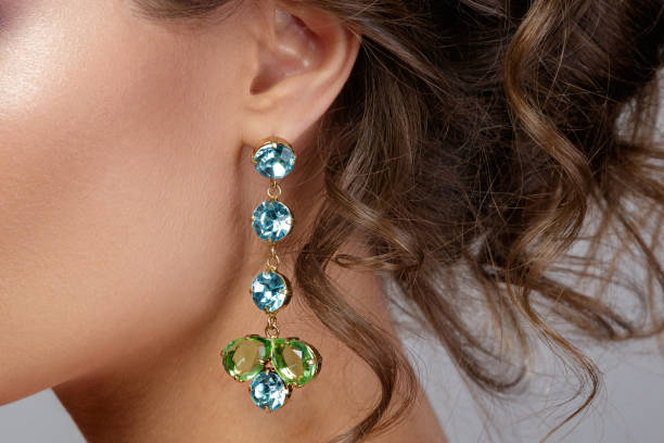 istock Woman wearing beautiful and expensive earrings 1299767768