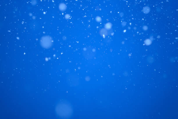 istock flying heavy snow on a black background of the blue sky 1299768781