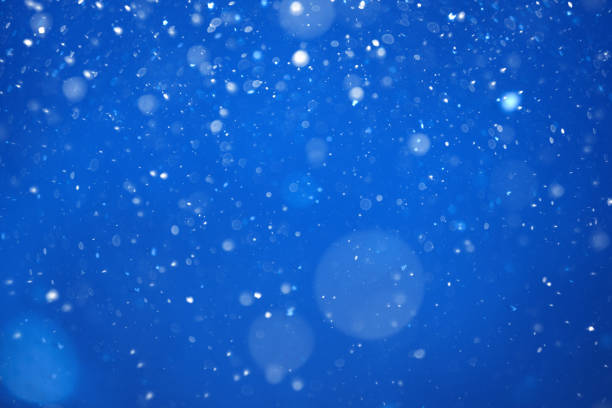 istock flying heavy snow on a black background of the blue sky 1299768977