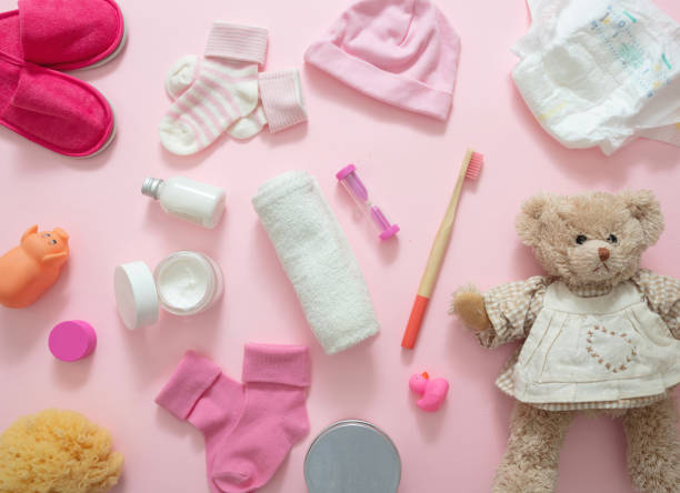 istock Baby bathing accesories on pink background, top view 1299775841