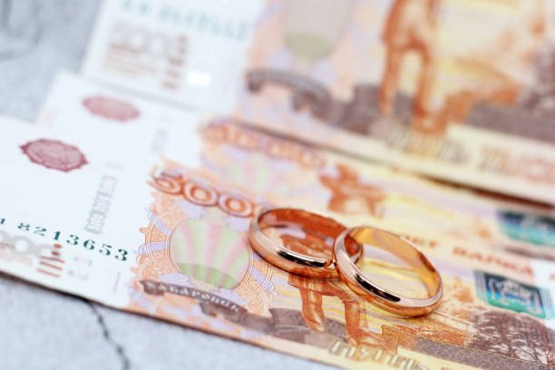 istock Two wedding rings and russian money 1299780667