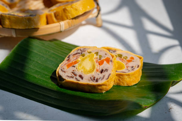 istock Mixed pork bologna roll with salted egg on green leaf decor asian food - Cha lua hoa 1299780914