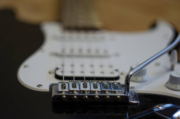 istock Close up metallic guitar bridge 1299784153