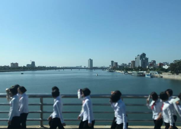 North Korean students in Front of Pyongyang Skyline