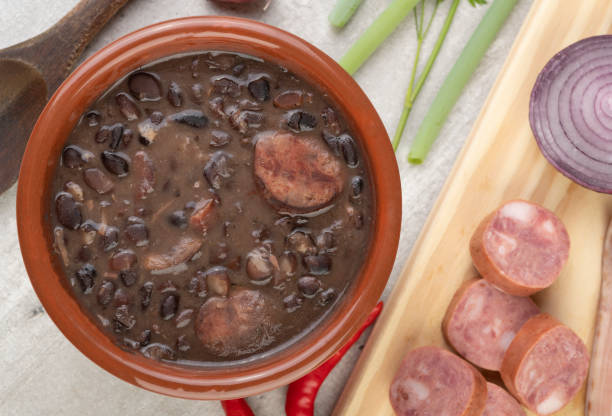 istock Traditional brazilian feijoada in a bowl with ingredients 1299786878