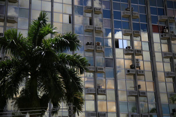 salvador, bahia, brazil - january 25, 2021: air conditioners are seen on the facade of a commercial building in the city of Salvador.
