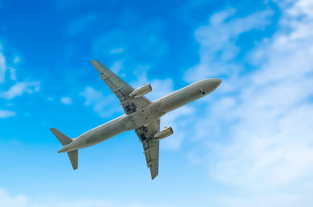 Airplane silhouette in the sky Airplane silhouette in the sky gatwick airport photos stock pictures, royalty-free photos & images