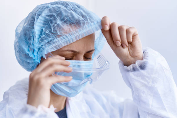 istock Exhausted tired nurse in the hospital. 1299792980