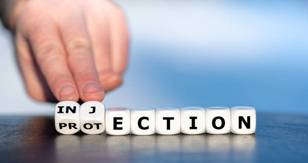 istock Dice form the words protection and injection. Symbol for a covid 19 vaccination. 1299795010