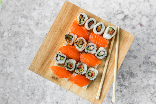 istock Fresh sushi selection on wooden board 1299795303