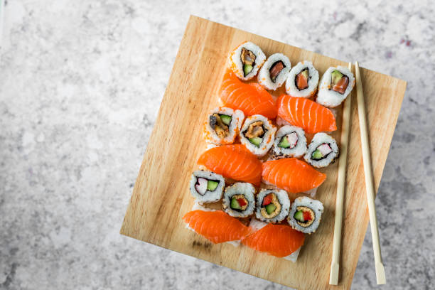 istock Fresh sushi selection on wooden board 1299795506
