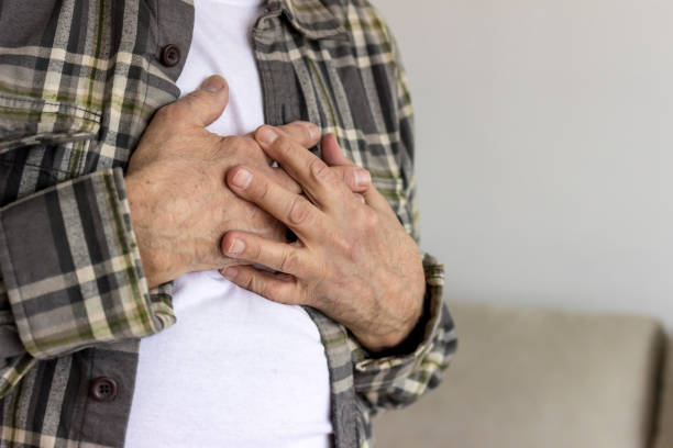 istock Senior man with chest pain. 1299795596