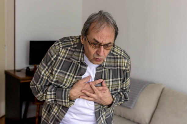 istock Senior man with chest pain. 1299795612