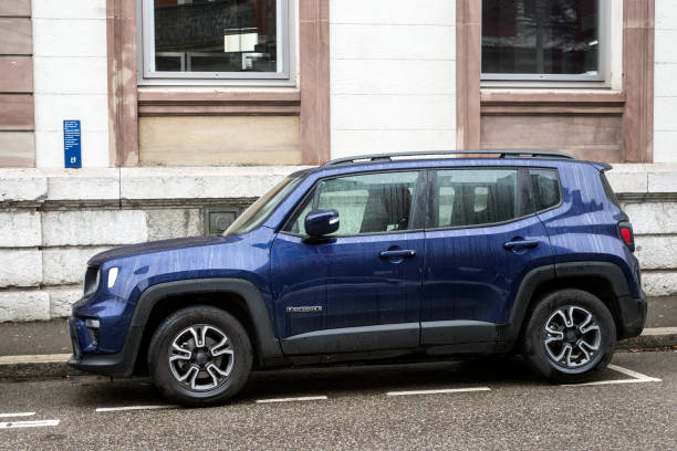 profile view of blue jeep renegade car parked in the street - editorial sports utility vehicle car jeep imagens e fotografias de stock