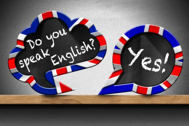Photo of Do You Speak English and Yes - Two Speech Bubbles on Wooden Shelf