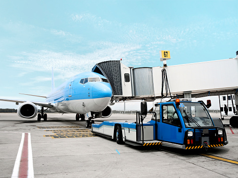 cargo airplane being loaded on an airport