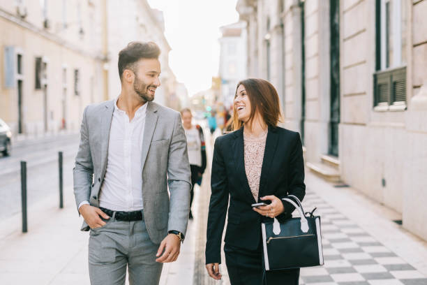 istock Business colleagues walking through the city 1299800273