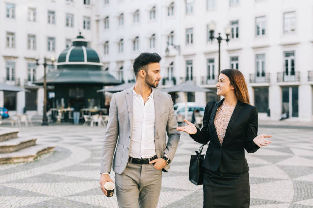 istock Coworkers having a chat in the city 1299800296