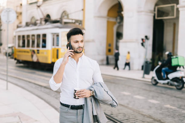 istock Businessman walking through the city 1299800307
