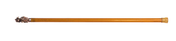 istock old wood cane isolated on wooden background 1299803094