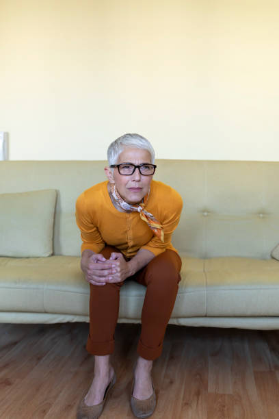 istock An Older Woman with Chronic Knee Problems and Pain. 1299805160
