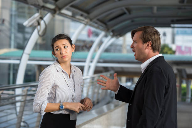 istock Boss Shouting At team worker in city 1299806403